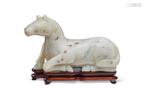 A GREYISH-WHITE JADE FIGURE OF A RECUMBENT HORSE