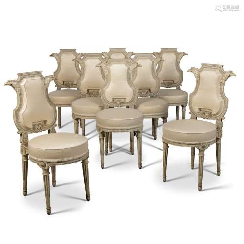 A SET OF EIGHT LOUIS XVI GREY AND WHITE-PAINTED CHAISES.BY G...