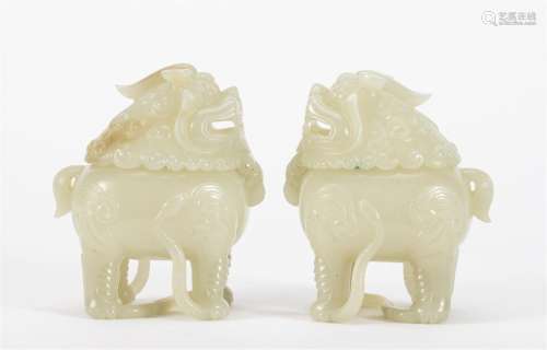 A PAIR OF CHINESE JADE LIONS ORNAMENTS