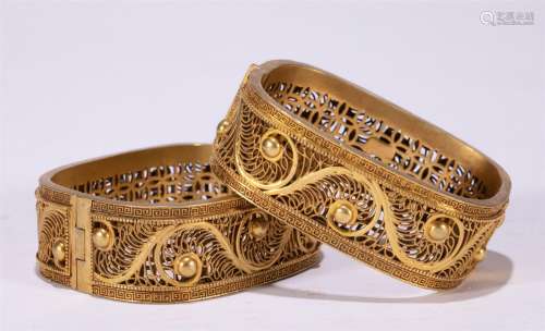 A PAIR OF CHINESE GILT SILVER BRACELETS