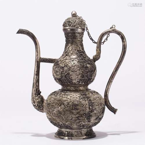 A CHINESE SILVER DRAGON WINEPOT