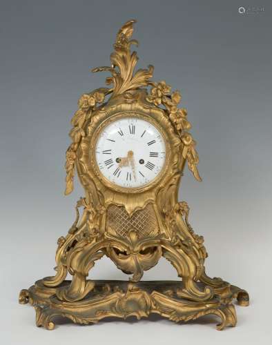 Louis XV style clock; late 19th century.Gilt bronze.Signed d...