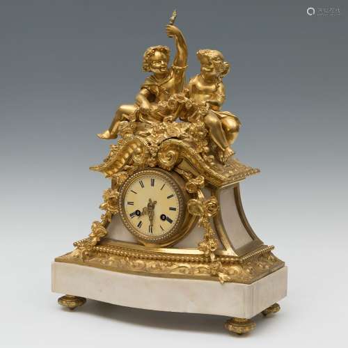 Napoleon III clock; circa 1870.Gilt bronze and white marble....