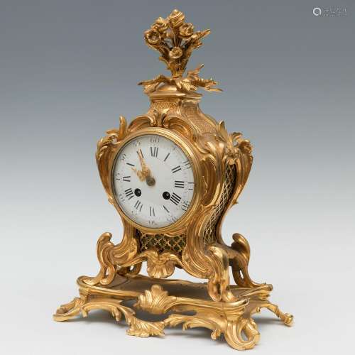 Table clock: Louis XV style; circa 1870.Gilt bronze.Paris mo...