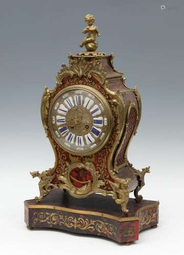 Boulle style clock; France, late 19th century.Gilt bronze, e...