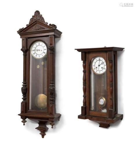 Set of two Alfonsinos clocks; late 19th century.Carved wood....