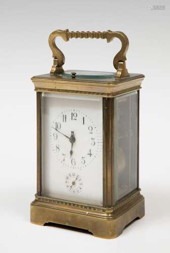 Travel clock; late 19th century.Bronze and bevelled glass.No...