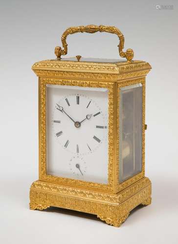 Travel clock; late 19th century.Bronze and bevelled glass.No...