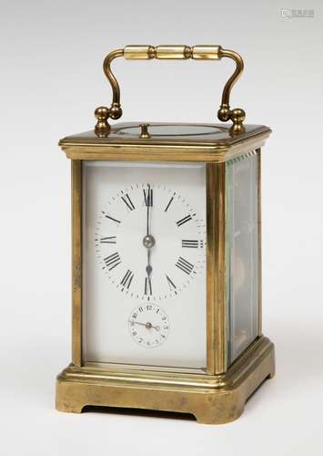 Travel clock; late 19th century.Bronze and bevelled glass.No...