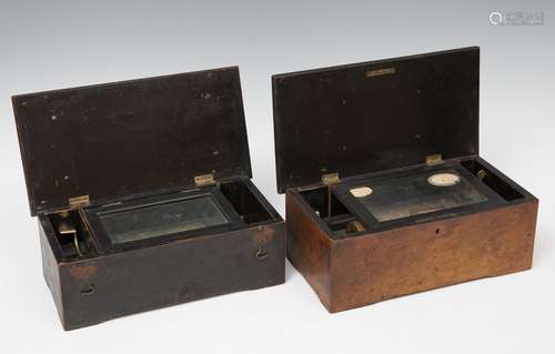 Pair of musical boxes, XIX century.Wood, brass, iron and gil...