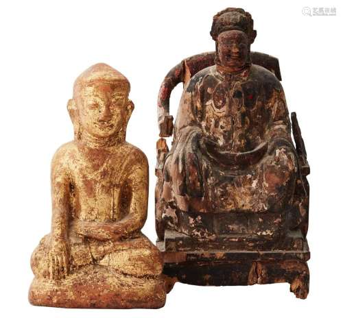 A CHINESE CARVED AND GILTWOOD FIGURE OF A SEATED OFFICIAL AN...