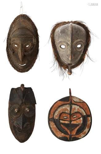 A GROUP OF FOUR POLYNESIAN TRADITIONAL MASKS