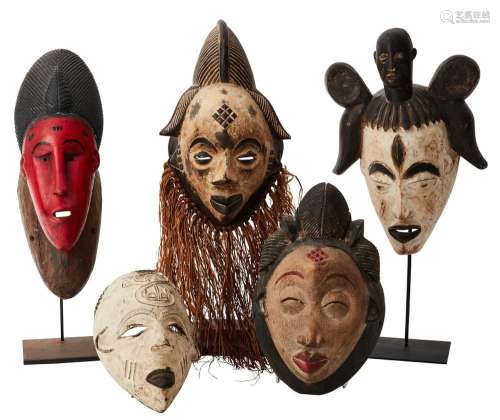 A COLLECTION OF FIVE AFRICAN TRADITIONAL MASKS