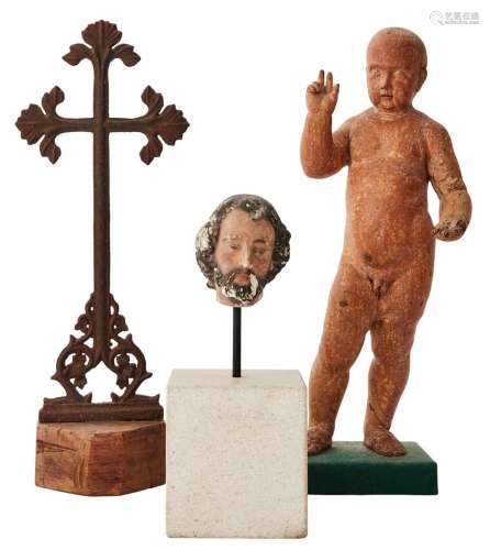 A CARVED WOODEN FIGURE OF THE CHRIST CHILD, A CAST IRON CROS...