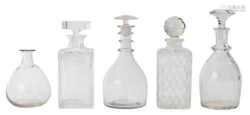 A GROUP OF FOUR DECANTERS AND A GLASS CARAFE