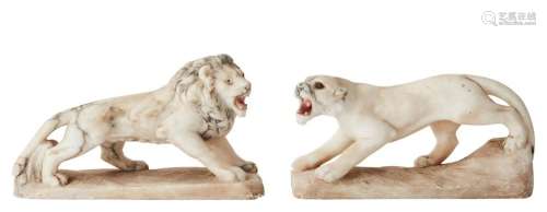 A CARVED ALABASTER LION AND LIONNESS