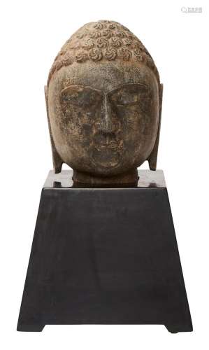 A CHINESE CARVED STONE HEAD OF BUDDHA