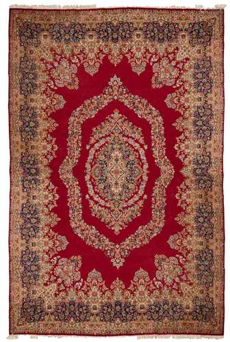 A HAND WOVEN PERSIAN CARPET