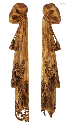 A PAIR OF CARVED AND GILT PINE DRAPERIES