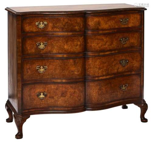 A WALNUT CHEST OF DRAWERS