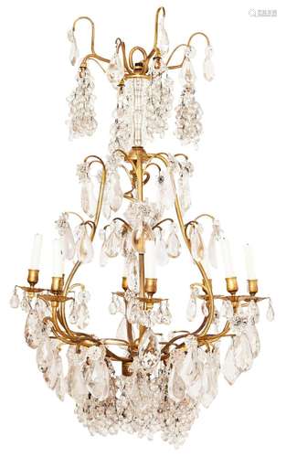 A LOUIS XV ORMOLU AND CRYSTAL EIGHT LIGHT CHANDELIER