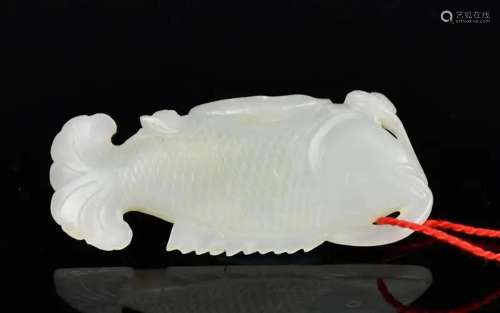 A White Jade Carved Fish Toggle, Qing