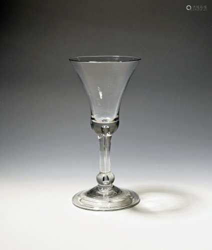 A large wine glass or goblet c.1740, the bell bowl raised on...