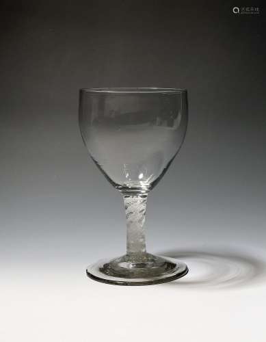 A large glass goblet c.1765, the generous bowl of slight oge...