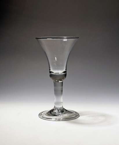 A large wine glass or goblet c.1750, the deep bell bowl rais...