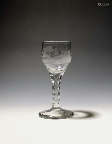 A small wine glass c.1770, the rounded bowl engraved with a ...