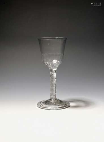 A wine glass c.1750, the ogee bowl with moulded flutes aroun...
