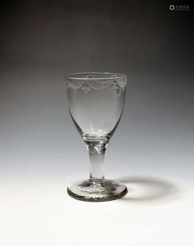 A large wine glass or goblet c.1750-60, the rounded funnel b...