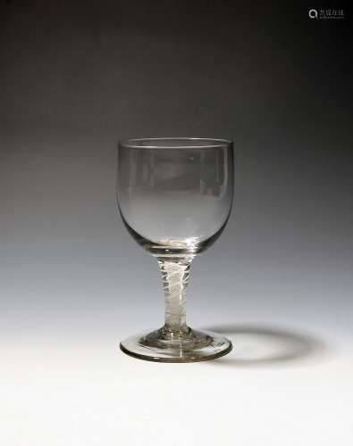 A wine goblet c.1760-70, the wide rounded bowl raised on a d...