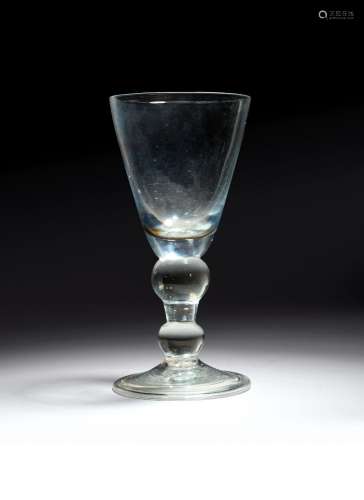 A heavy baluster goblet c.1710, the generous round funnel bo...