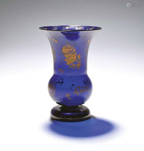 A blue glass vase c.1770, the thistle shape gilded in the Lo...