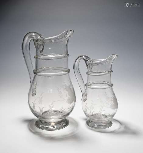 A graduated pair of glass jugs late 18th century, roughly en...