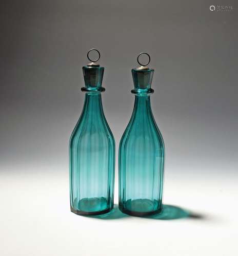 A pair of green glass decanters and stoppers 19th century, t...