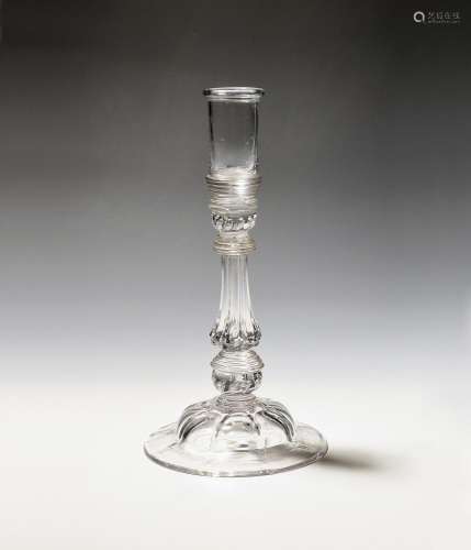 A rare composite stem glass candlestick c.1740, the deep sco...