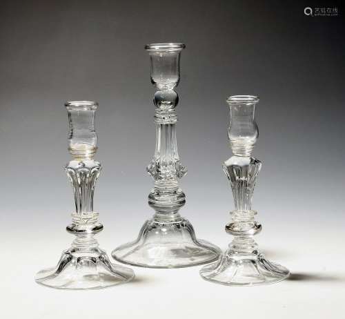 A pair of small moulded glass candlesticks mid 18th century,...