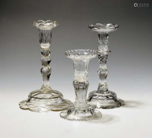 Three small cut glass candlesticks c.1760-80, the shaped sco...
