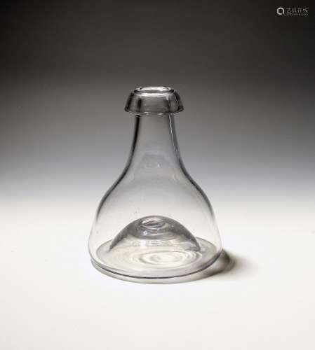 A glass hookah base, of near bell shape with a kick-in base,...