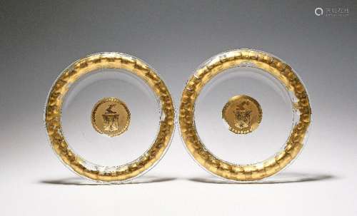 A pair of armorial verre eglomisé glass dishes late 18th/19t...