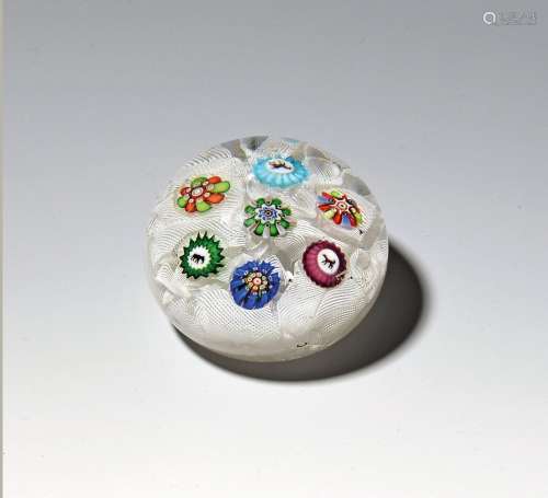 A small Baccarat spaced paperweight c.1850, set with seven v...