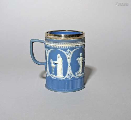 A silver-mounted Jasperware mug c.1796, decorated in white o...