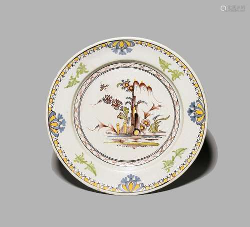 A large delftware charger c.1780, probably Lambeth, painted ...