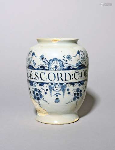 A delftware dry drug jar c.1760, painted in blue with a cart...