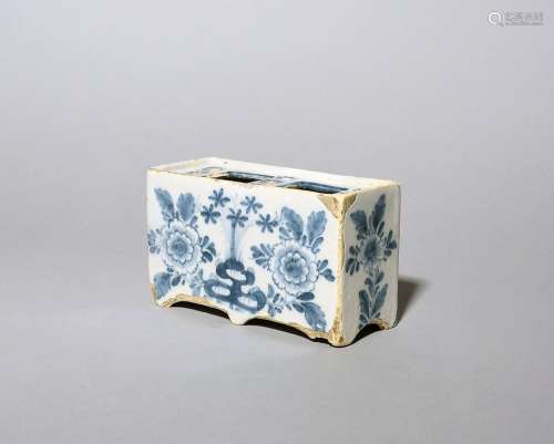 A delftware flower brick c.1770, of rectangular form, painte...