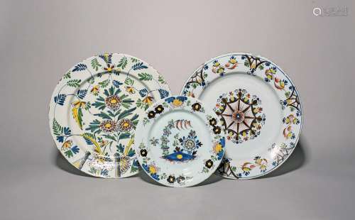 Two delftware chargers and a plate c.1760-90, one Bristol an...