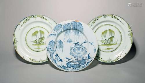Three delftware chargers c.1760-80, two decorated in green m...