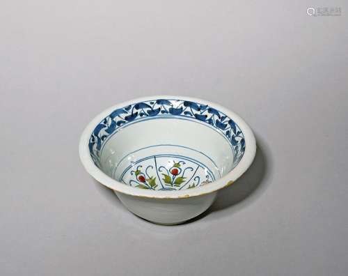 A deep delftware bowl c.1730-40, probably Bristol, decorated...